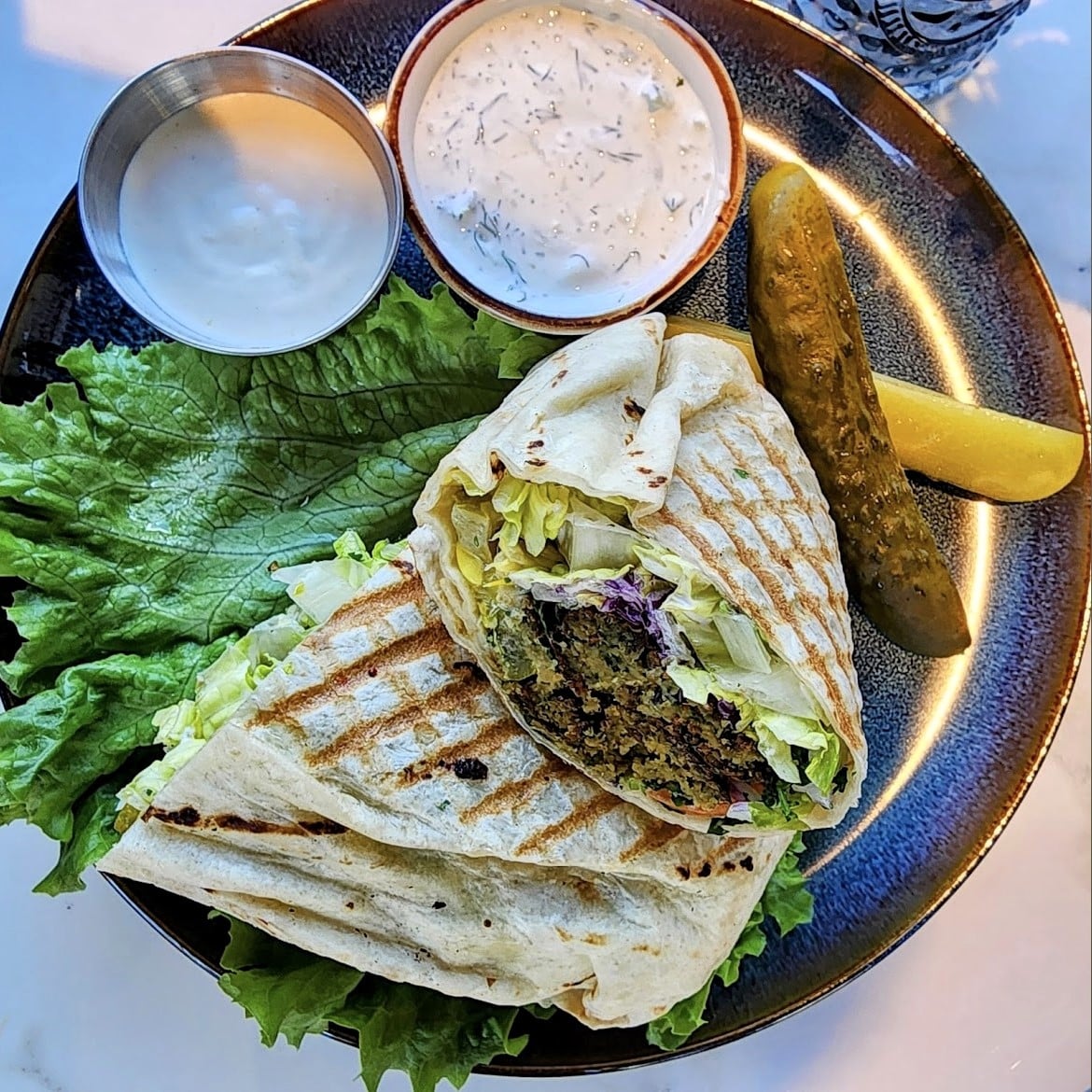 Read more about the article Unveiling Mediterranean Mastery: The Falafel Wrap at Samos Café & Grill